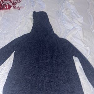 Hooded Barefoot Dreams dark gray cardigan with pockets and slits on both sides.